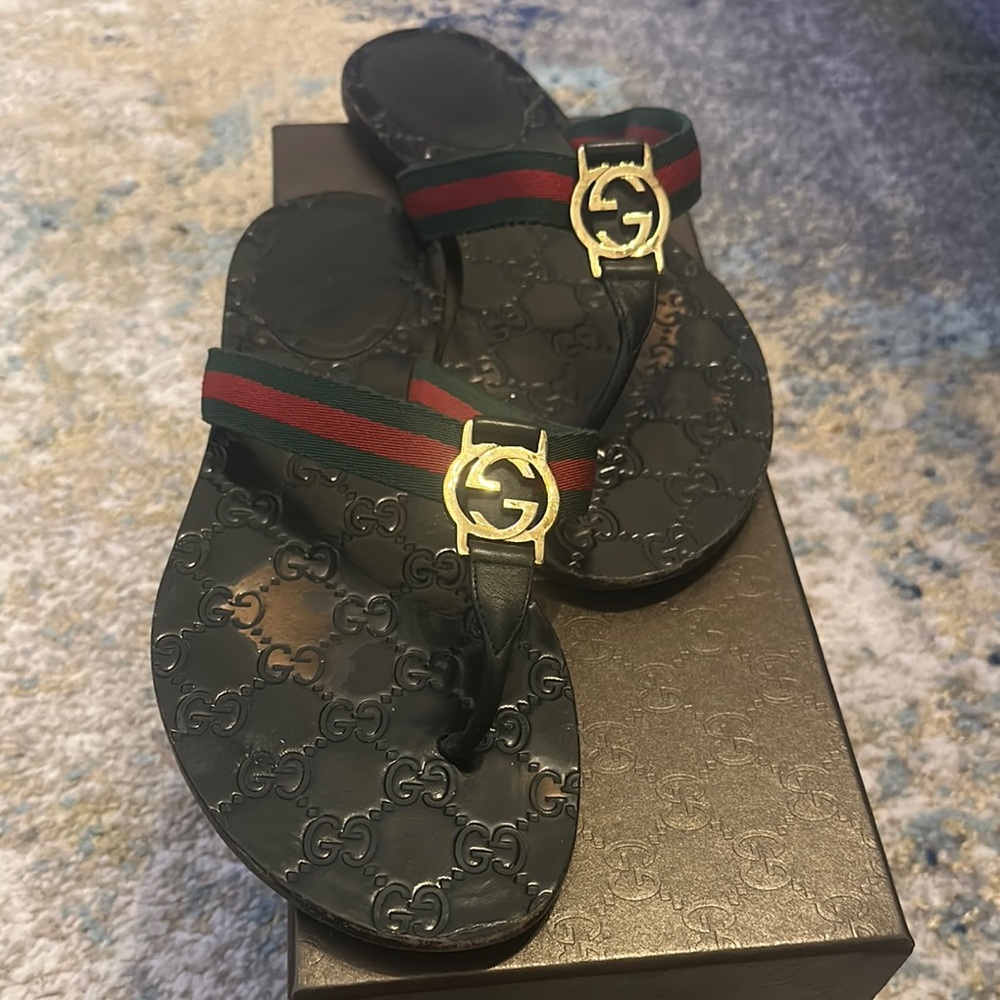 Gucci Black Flip Flops with Gold Emblem